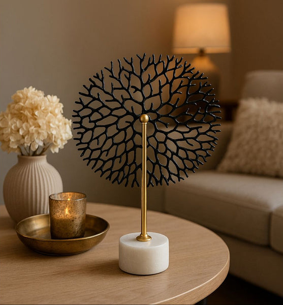 Decorative lamp with round flower stem table decor on a table in a living room setting