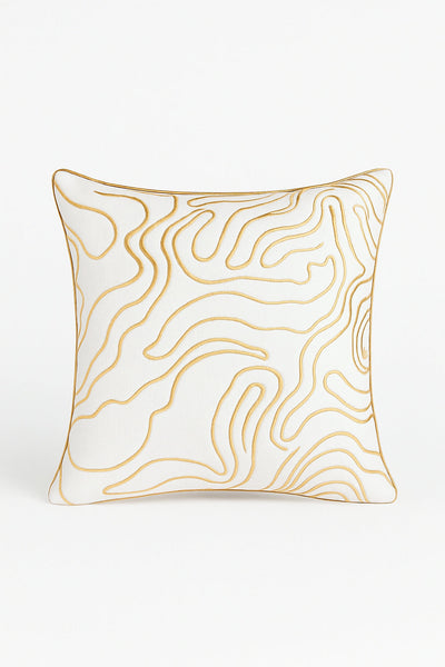 Designer cream and gold cushion with swirl pattern and foil detailing for modern interiors.