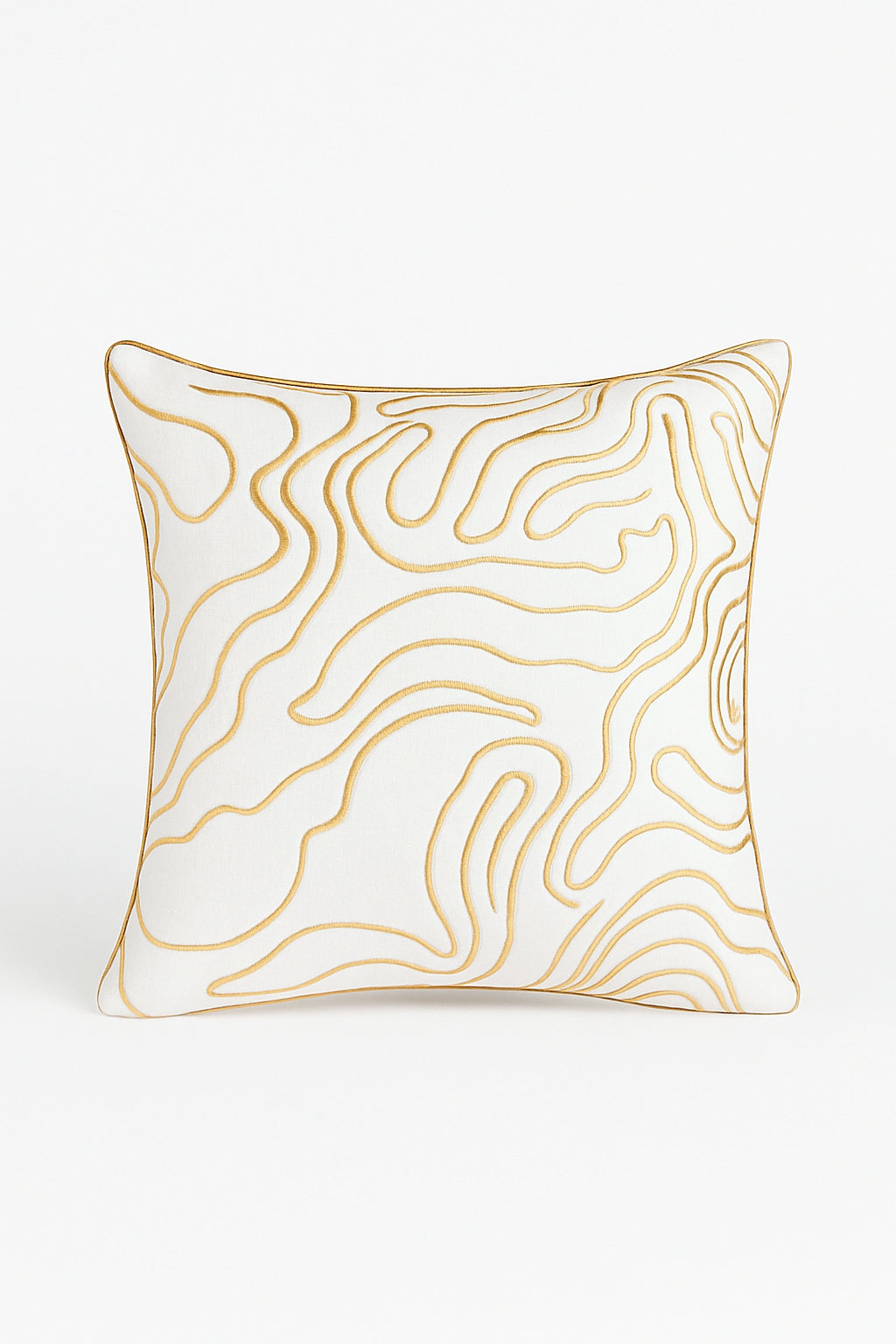 Designer cream and gold cushion with swirl pattern and foil detailing for modern interiors.