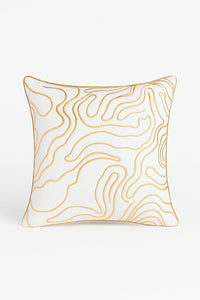 Designer cream and gold cushion with swirl pattern and foil detailing for modern interiors.