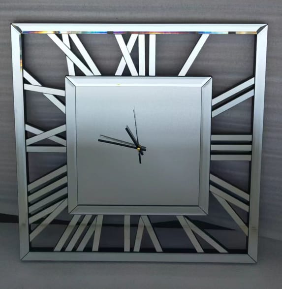 Decorative silver mirrored square Roman numeral clock, sleek reflective design for modern home décor.