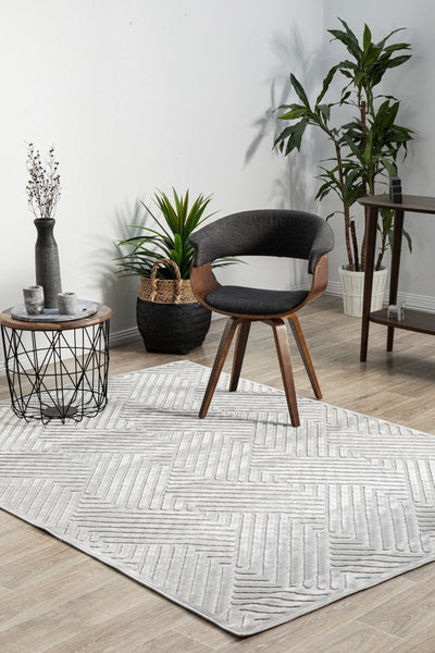 York Cindy Silver Rug in a bright living room setup, highlighting its soft texture and stylish geometric pattern.