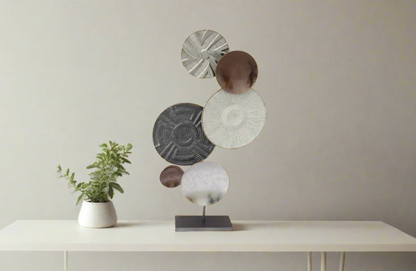 Contemporary abstract table décor styled on a console table with a minimalist look.