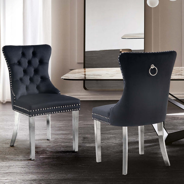 Elegant velvet dining chairs with tufted back, stud trim, and pull-out ring on silver legs.