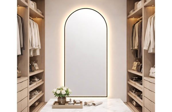 Black LED arch mirror glowing in stylish dressing area creating warm light and sophisticated atmosphere