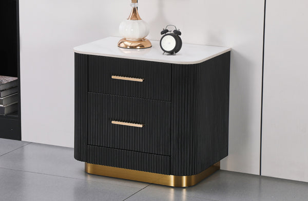 modern black gold bedside table with lamp and decor in bedroom