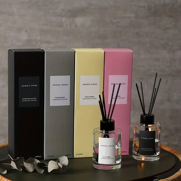 Stylish 4-scent aroma diffuser set with modern packaging and glass bottles.