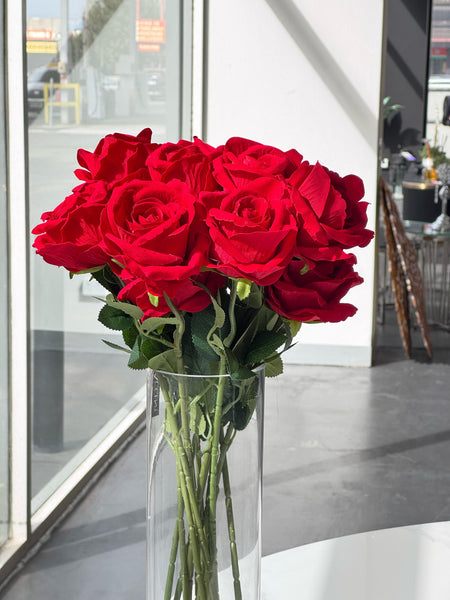 Vibrant red artificial rose styled beautifully in modern decor setting.