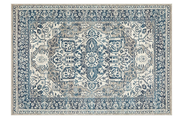 Flat lay of Babylon Blue Rug with ornate floral motifs