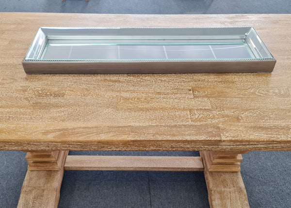 Elegant silver mirror tray with a luxe beaded frame.