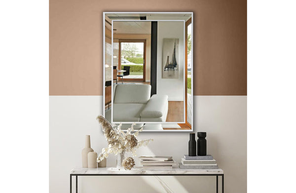 Elegant small white beaded framed mirror styled above console in modern living space