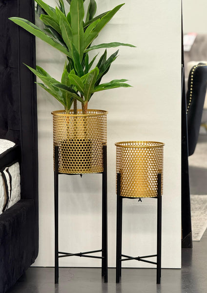 Set of two gold Beehive Planters with black legs, featuring indoor plants in a modern lifestyle setting.