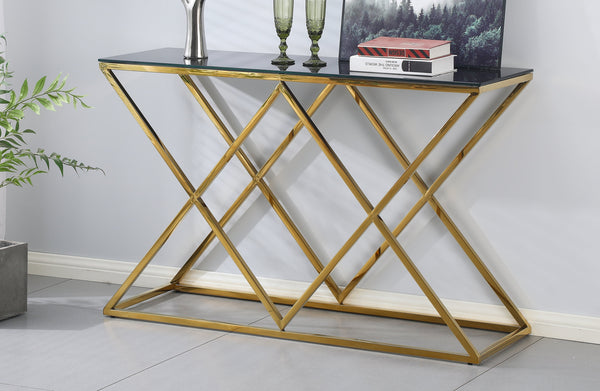 Beverly console table with gold frame and black glass top styled in a modern living room.