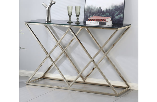 Beverly console table with silver frame and clear glass top styled with artwork and décor.