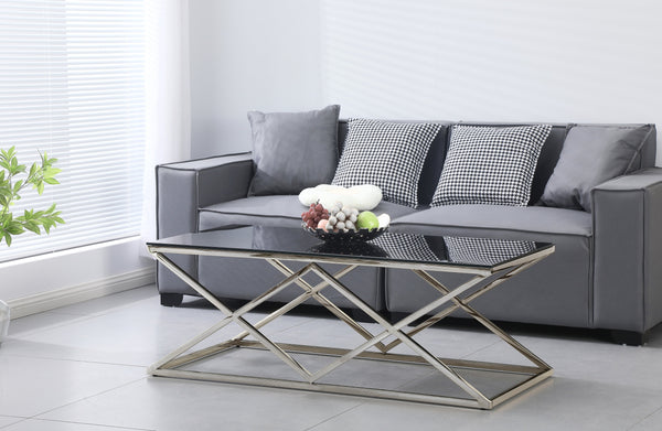 Beverly coffee table with polished silver frame and black tempered glass top, stylish luxury.