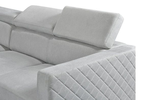 Close-up of Boston modular lounge adjustable headrest in light grey fabric with diamond stitching.
