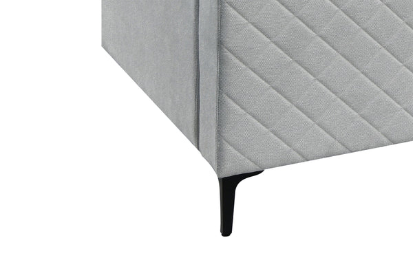Boston modular lounge detail showing slim black leg and diamond stitched light grey fabric side.