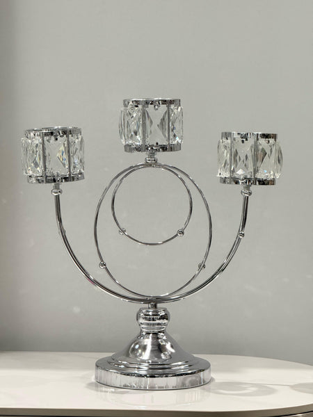 Sleek silver candle holder with crystal cups for refined décor.