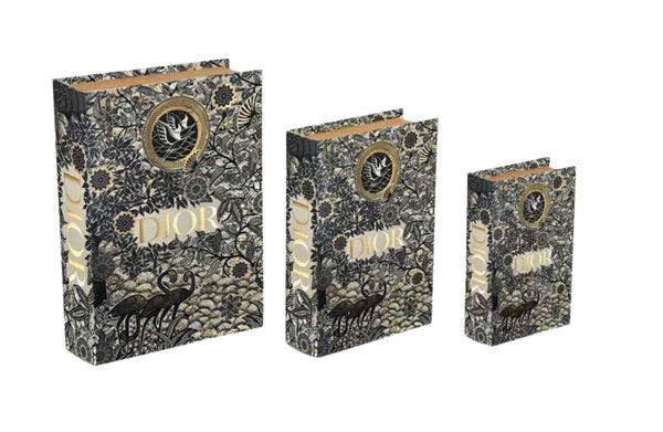 Set of black and gold designer faux book storage boxes in small medium and large sizes luxury decor style.