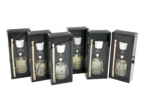 Set of 300ML fragrance diffusers with white ceramic caps, assorted scents, and elegant boxed packaging – a stylish aromatic addition to any room.