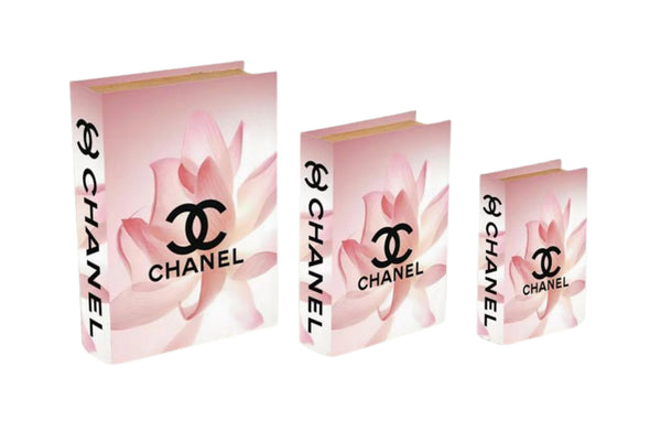 Set of pink floral designer faux book storage boxes in small medium and large sizes luxury decor style.