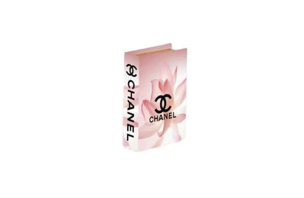 Small pink floral faux book storage box ideal for bedside styling or shelf decor.
