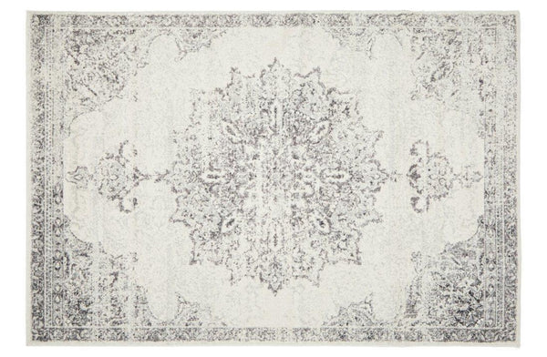 Elegant Chrome Rita Silver Rug featuring ornate geometric and floral motifs in silver, grey, and off-white tones.