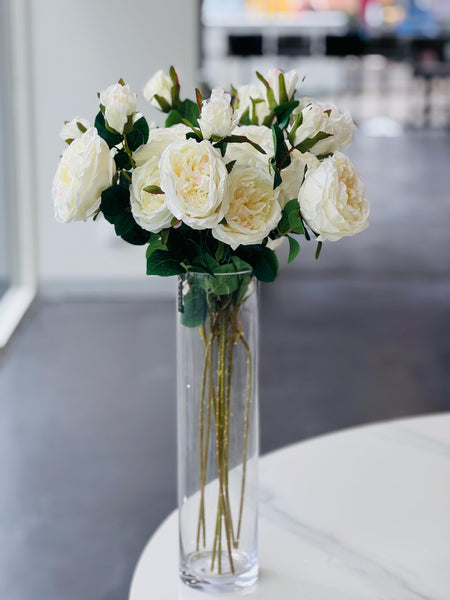  Clear cylinder vase with artificial white roses, elegant home décor.