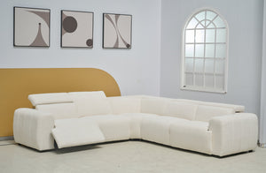 Cream Cleo boucle electric modular lounge styled in living space with powered recliner open.