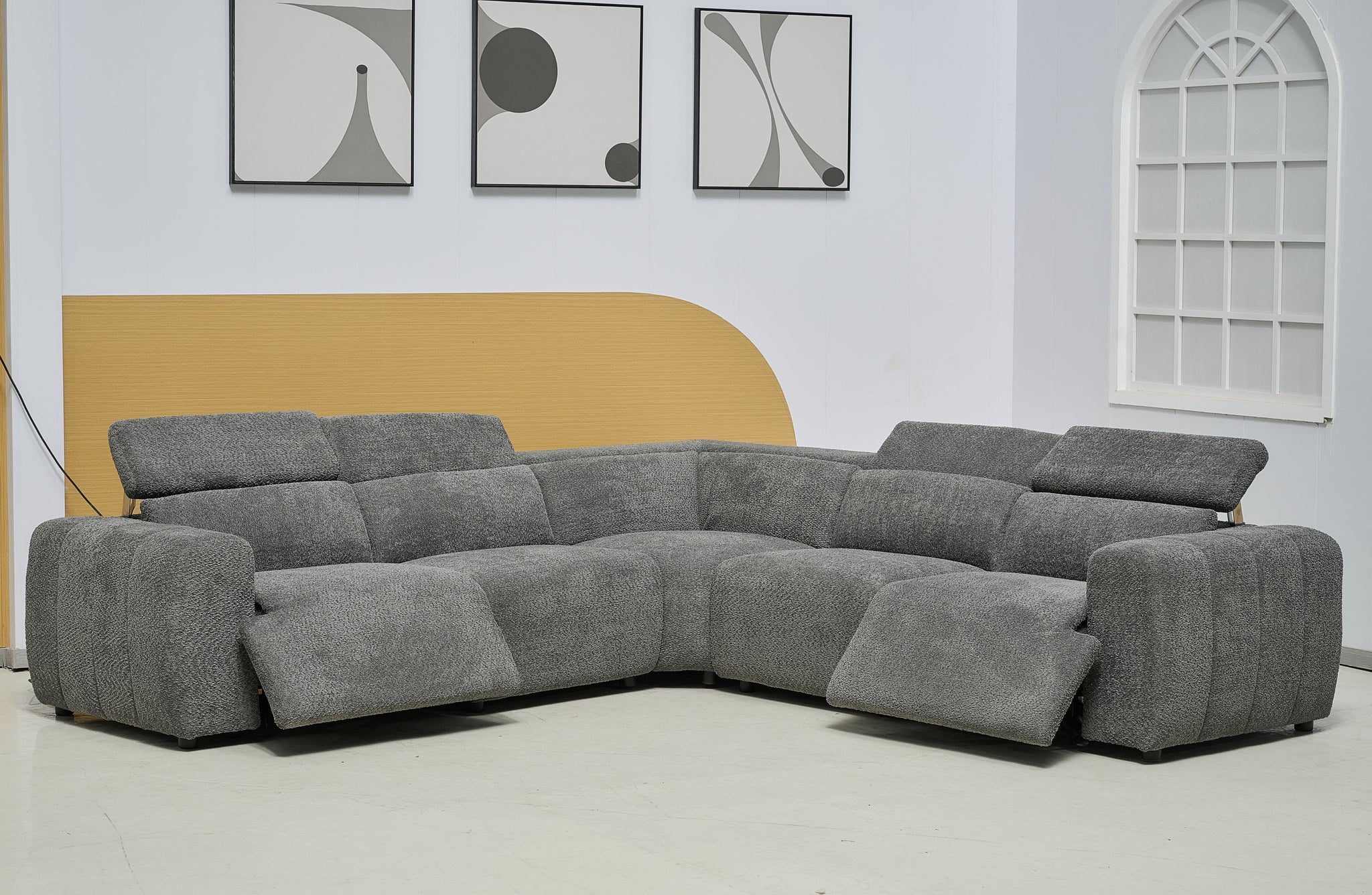 Grey Cleo boucle electric modular lounge with adjustable headrests and recliner function extended forward.
