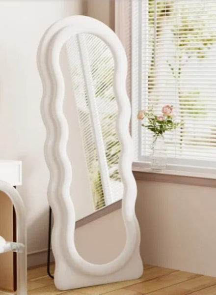 Cloud Wavy velvet mirror styled in bedroom near window with natural light and soft décor.