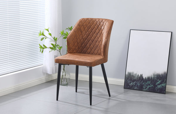 Brown cross pattern dining chair with black legs styled beside a window in a dining room.