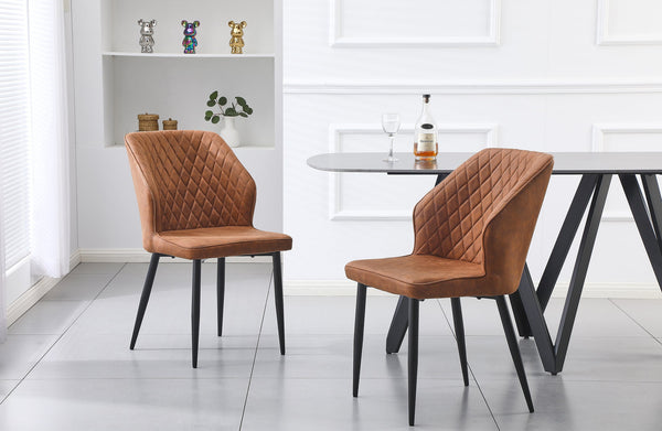 Pair of brown cross pattern dining chairs with black legs styled in a modern dining setting.