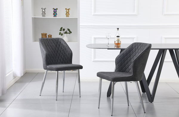 Pair of charcoal cross pattern dining chairs with silver legs styled around a dining table.