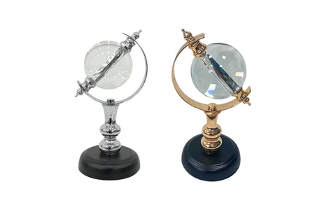 Elegant crystal globes in black with gold and silver finishes.