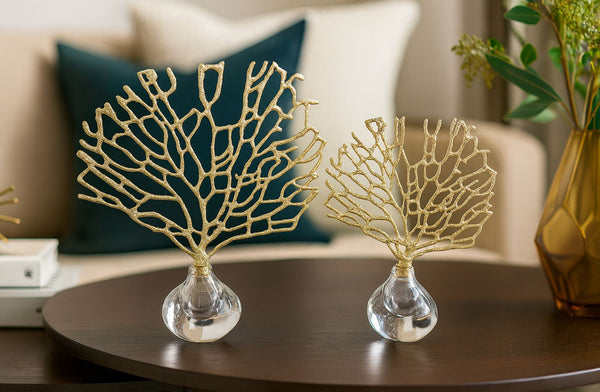 Decorative crystal gold tree set on a table with a blurred background
