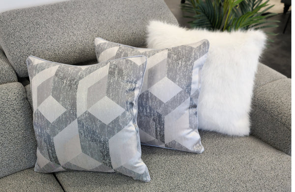 Diamant Grey luxury cushions styled on a modern grey sofa with geometric diamond design, 45x45cm.