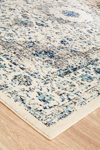 Neatly finished edge of the Evoke 21 White Rug showing quality stitching and craftsmanship.