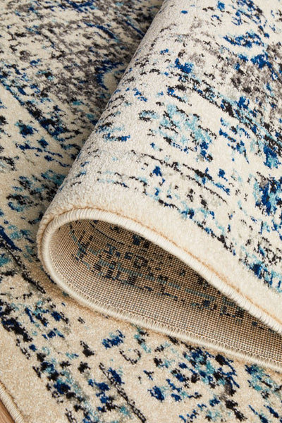  Folded view of the Evoke 21 White Rug illustrating pile thickness, durability, and backing material.