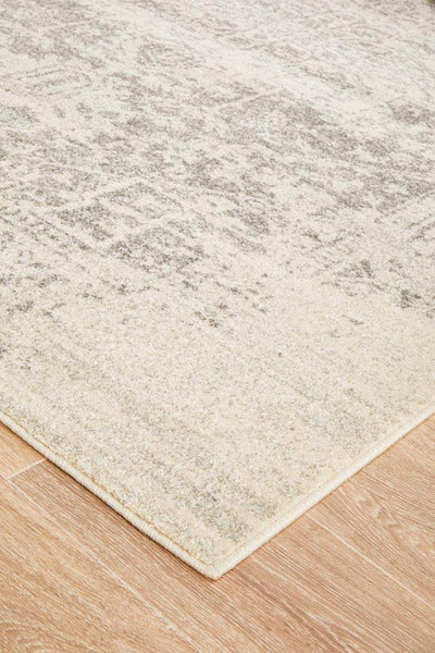 Flat edge view of white silver rug showing soft pile