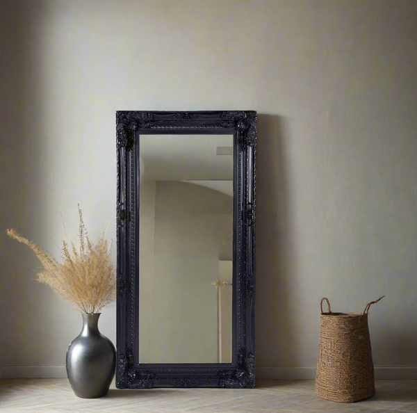 Black French provincial LUX ornate mirror styled with natural basket, pampas grass and beige wall.