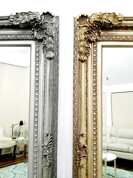 Close-up of French provincial LUX ornate mirror showcasing detailed antique gold and silver carving.