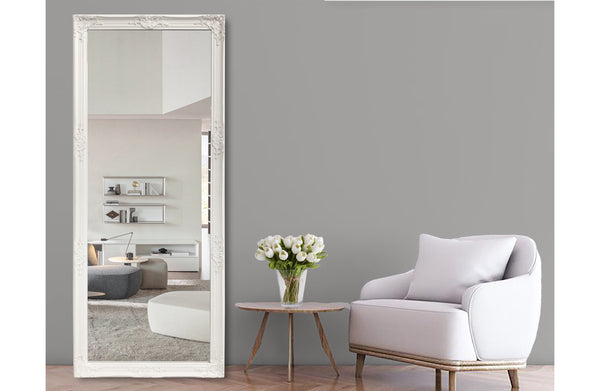 White French provincial ornate mirror styled with grey chair, side table and flower arrangement.