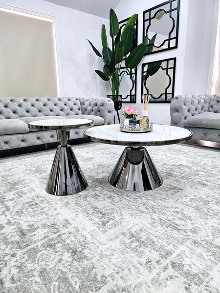 Glam black coffee and side table set with polished stainless steel frame and white marble top.