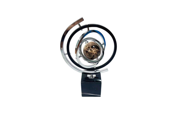 Polished black and silver globe table décor with a luxurious marble base.