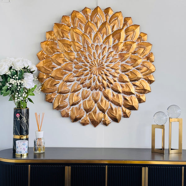  Luxurious gold flower wall art styled above console table with décor accents.