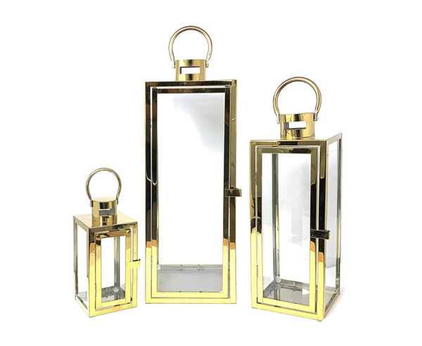Luxurious set of 3 gold lanterns in varying sizes for elegant home styling.