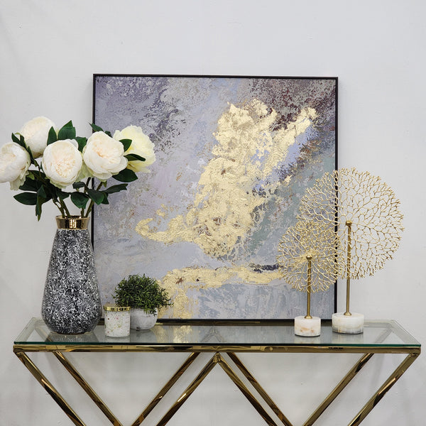 Glamorous gold marble art styled with luxe décor accents.