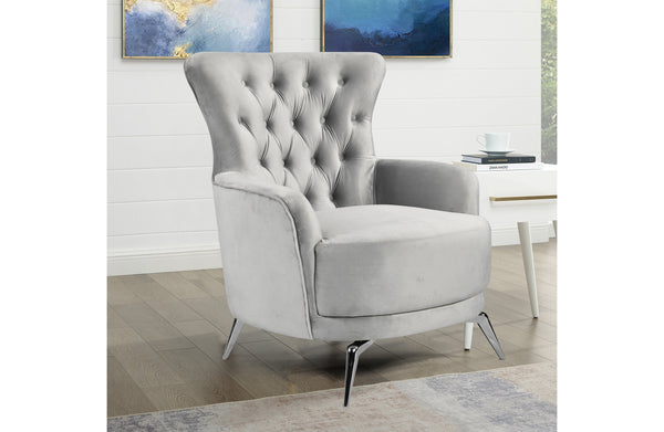 GRAND light grey velvet tufted wing chair with polished silver legs styled in modern living room