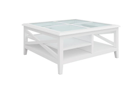 Hampton’s style white timber and glass coffee table with storage shelf, studio image.